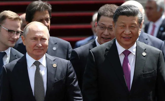 Russian leader Vladimir Putin arrives in China to meet Xi Jinping
